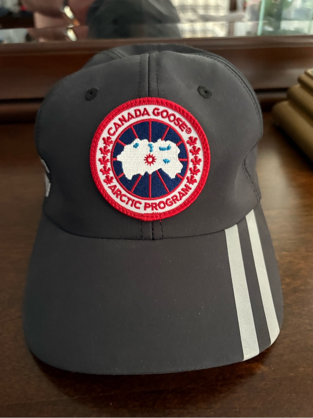 Canada Goose cap with reflective stripes.